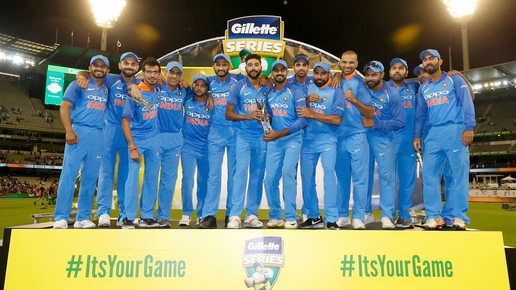 The Indian team poses with the trophy after claiming a 2-1 victory in their ODI series in Australia.