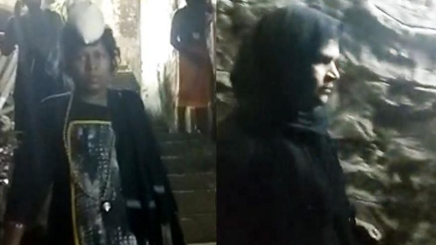 A video shows the two women dressed in black clothes at the Sannidhanam.
