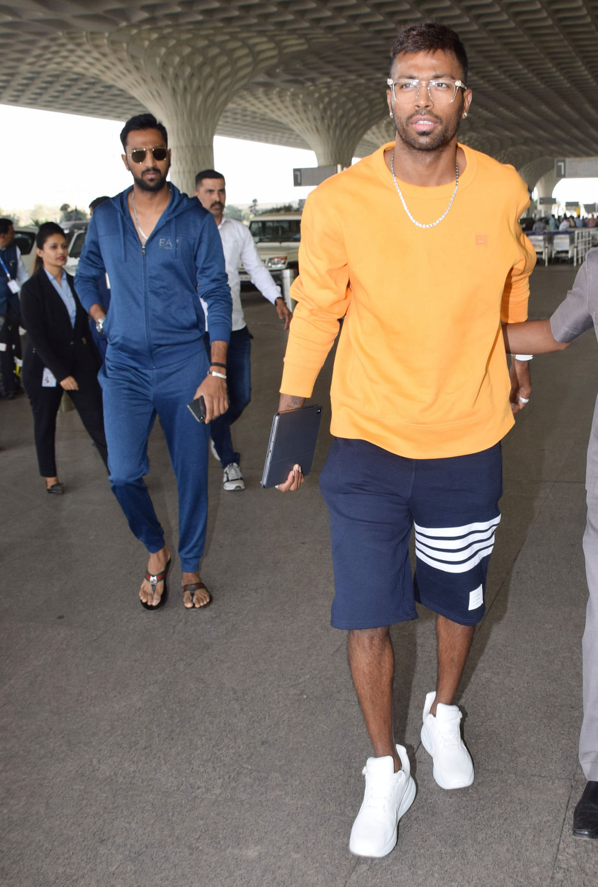Under-fire Indian cricketer spotted at the Mumbai airport, with no clarity yet on the course of action against him.