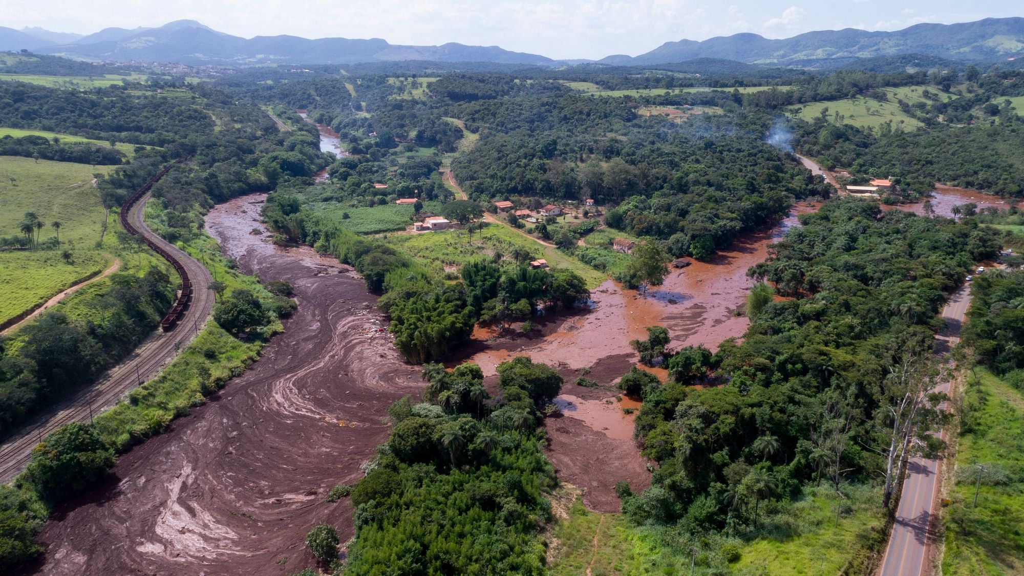 An aerial view shows flooding triggered by a dam collapse near Brumadinho, Brazil, Friday, 25 January.