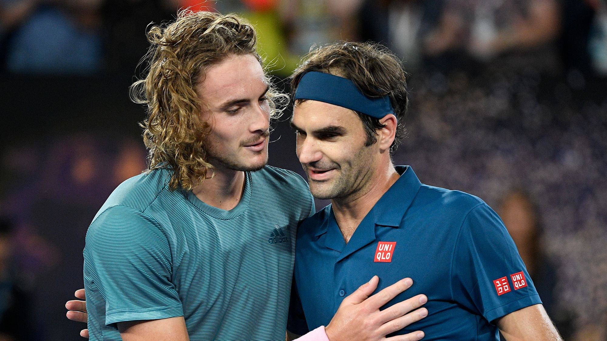 Greece’s Stefanos Tsitsipas, left, is congratulated by Switzerland’s Roger Federer after winning their fourth round match at the Australian Open.