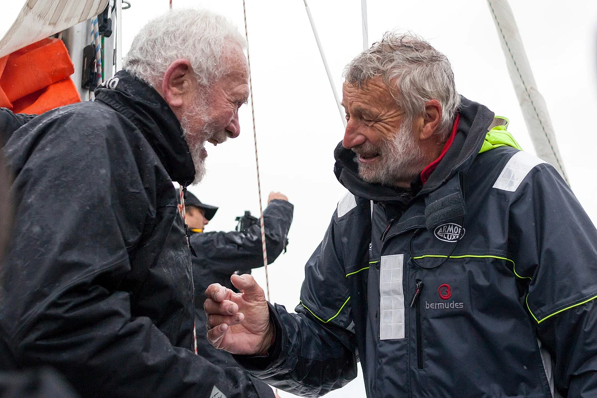 French sailor Jean-Luc Van Den Heede, 73, right, aboard his Rustler 36, Matmut, is congratulated by legendary sailor Sir Robin Knox-Johnston of Britain, after winning the Golden Globe Race, a single-handed round the world yacht race, after 212 days alone at sea, in Les Sables-d’Olonne harbor, western France, Tuesday, Jan. 29, 2019.