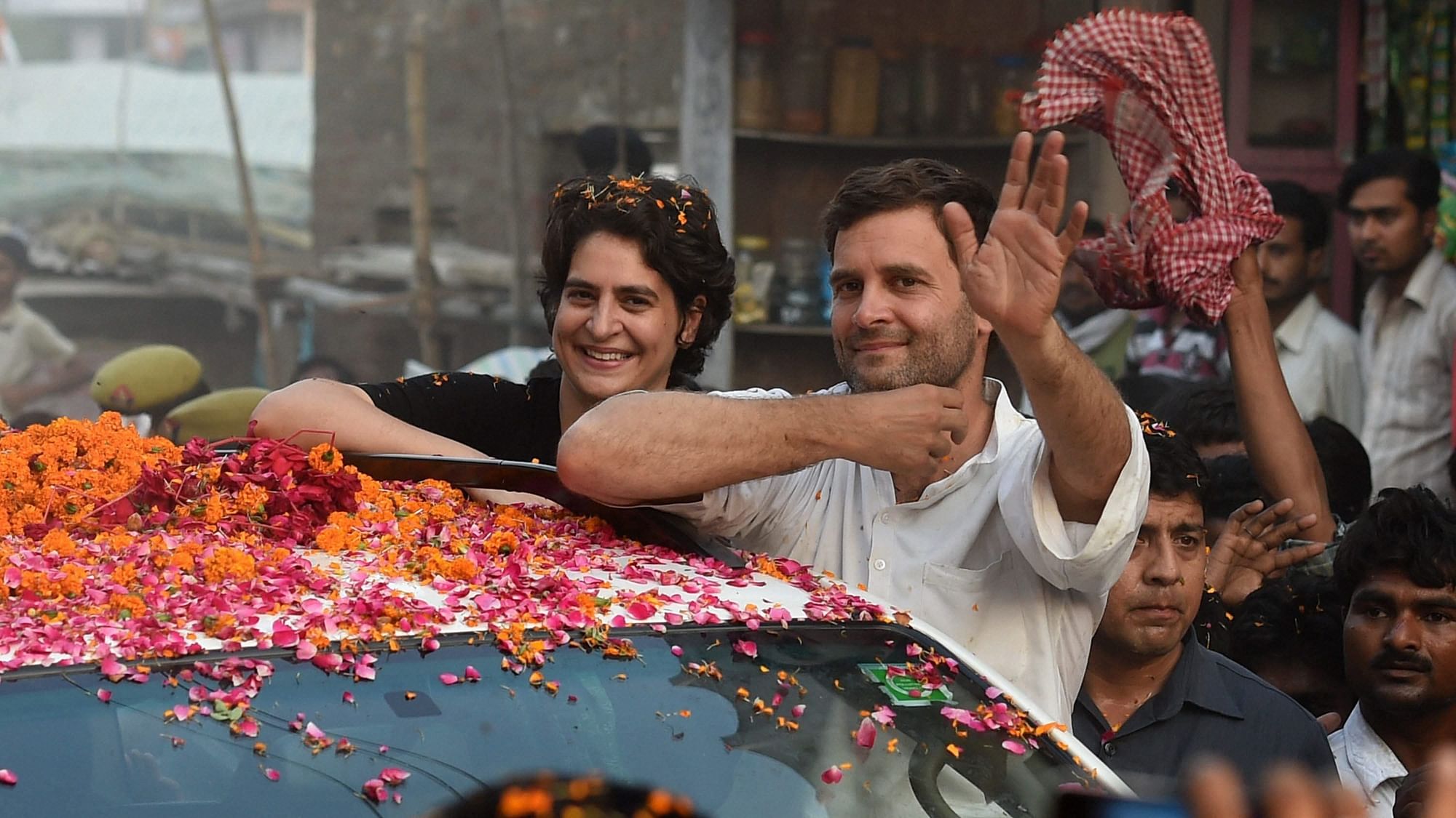 In this 4 May 2014 file photo, Priyanka Gandhi Vadra is seen with her brother and Congress President Rahul Gandhi during a road show in Amethi. &nbsp;
