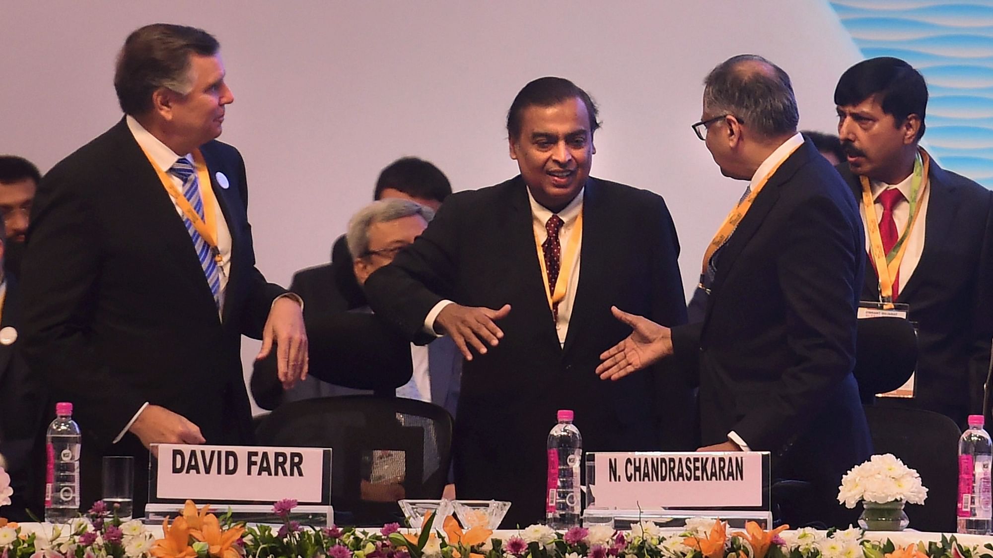  Tata Sons Chairperson Natarajan Chandrasekaran shakes hands with Reliance Industries Chairman Mukesh Ambani (Center) at the 9th edition of Vibrant Gujarat Global Summit-2019, in Gandhinagar on 18 Jan 2019.&nbsp;