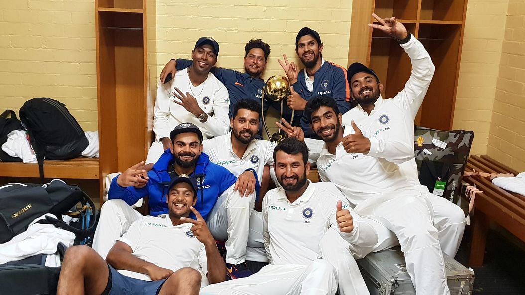 Indian team celebrate after winning their first-ever Test series win in Australia.