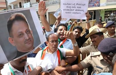 Bengaluru: Congress workers stage a demonstration against Union Minister Ananth Kumar Hegde in Bengaluru, on Jan 29, 2019. Hegde during his speech on Sunday in Kodagu district remarked that "any hand that touches a Hindu girl should not exist". (Photo: IANS)