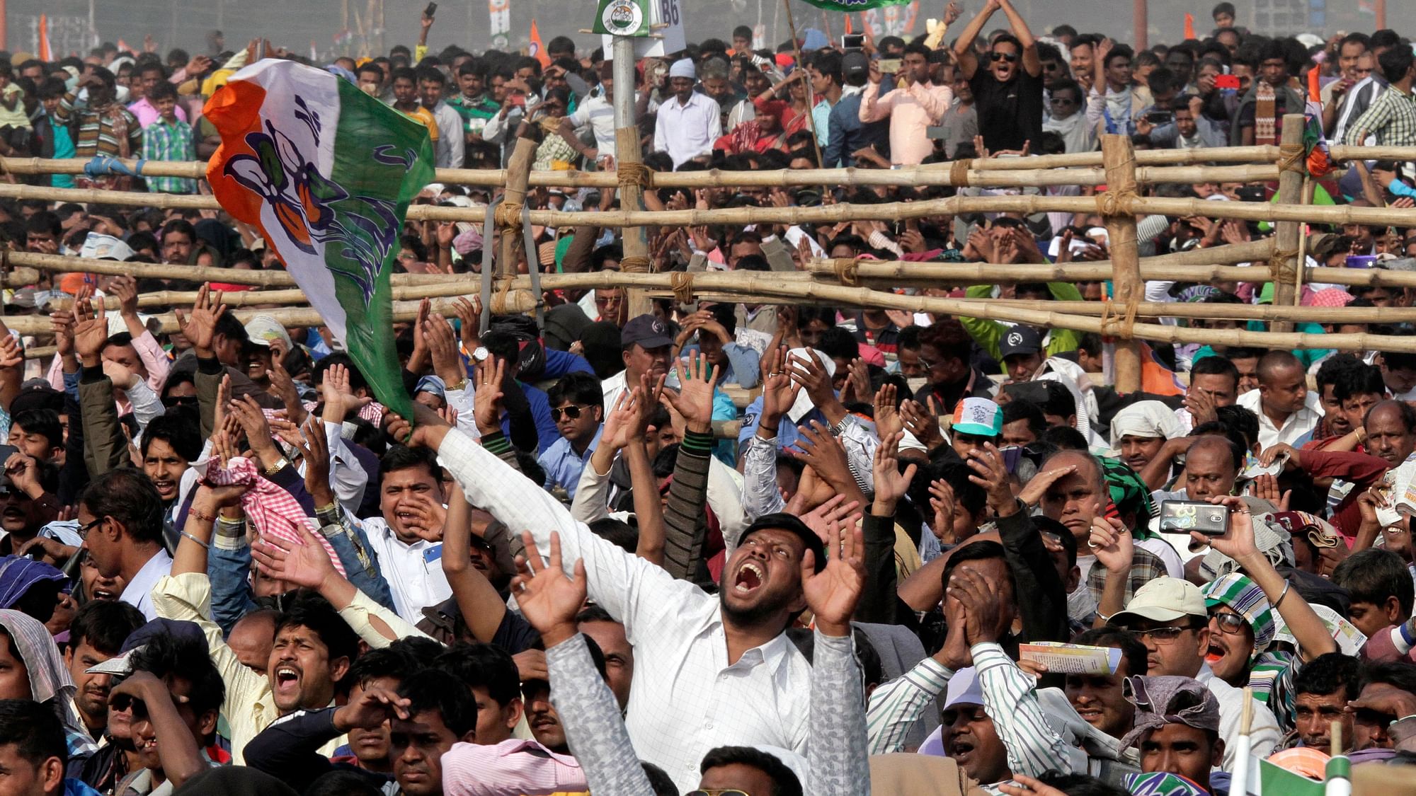 Supporters of Trinamool Congress party shout slogans during a public rally organized by Trinamool Congress party in Kolkata.