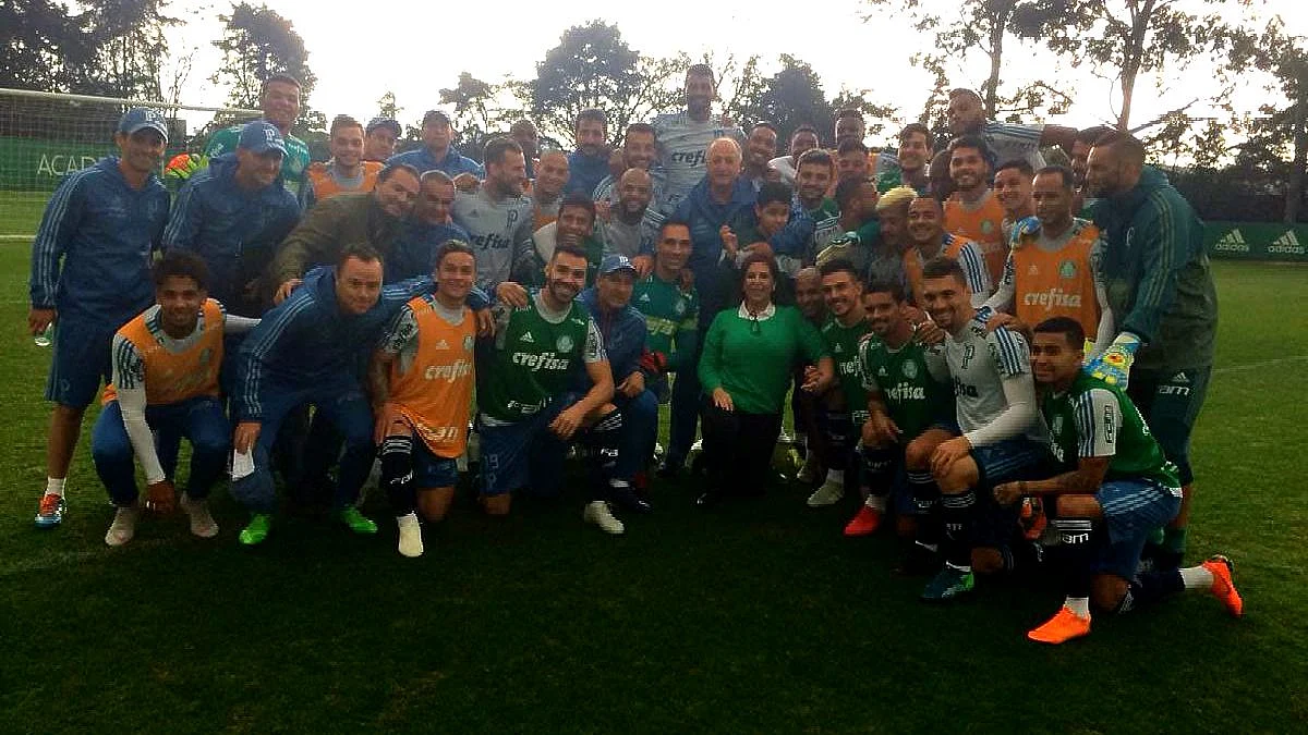 Silvia and Nickollas with the Palmeiras team during one of their training session.