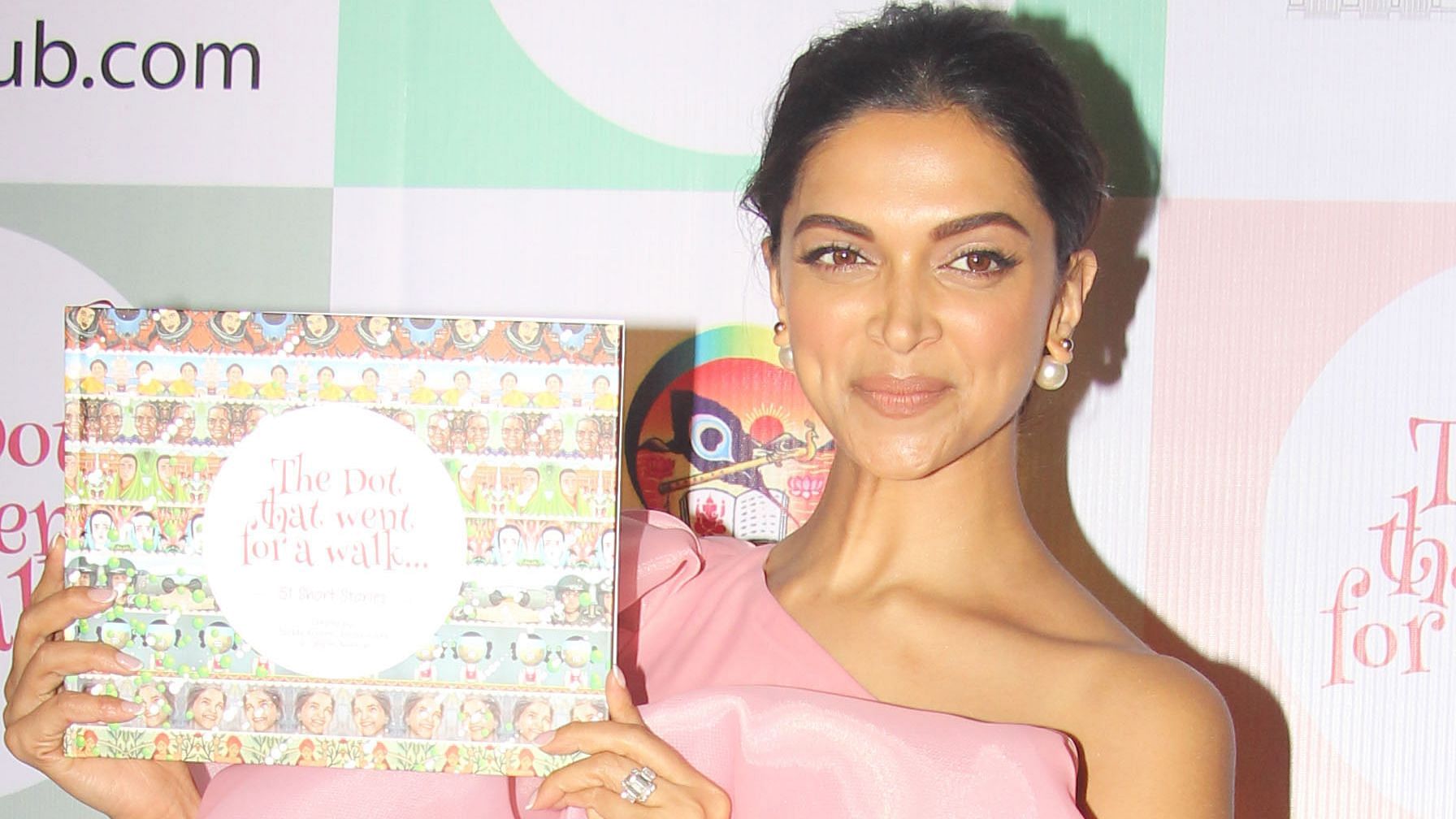 Deepika Padukone with <i>The Dot That Went For A Walk</i>.
