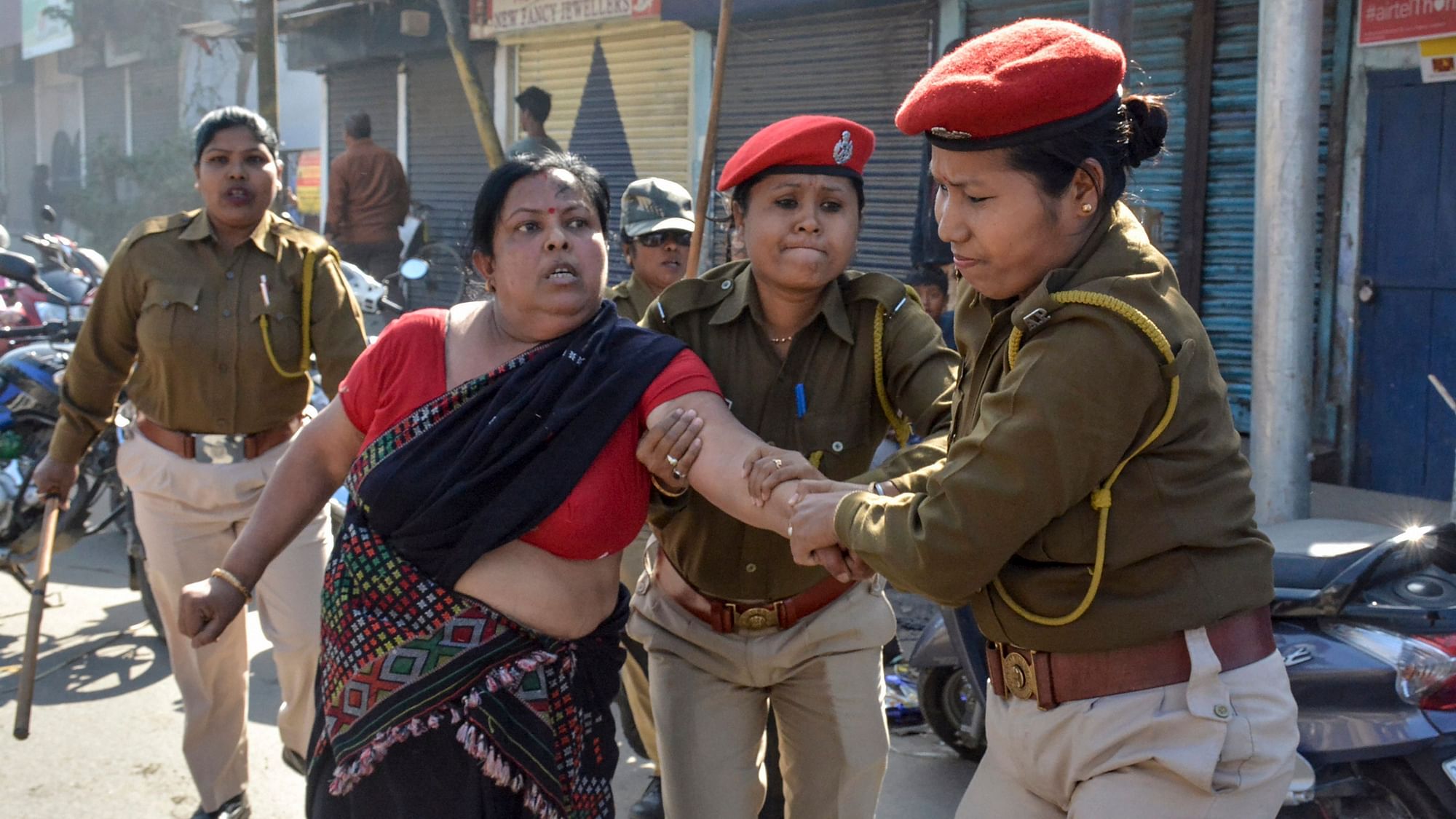 A file photo of an activist being detained by police personnel during a strike against the Citizenship (Amendment) Bill 2016, in Dibrugarh, on  8 January.