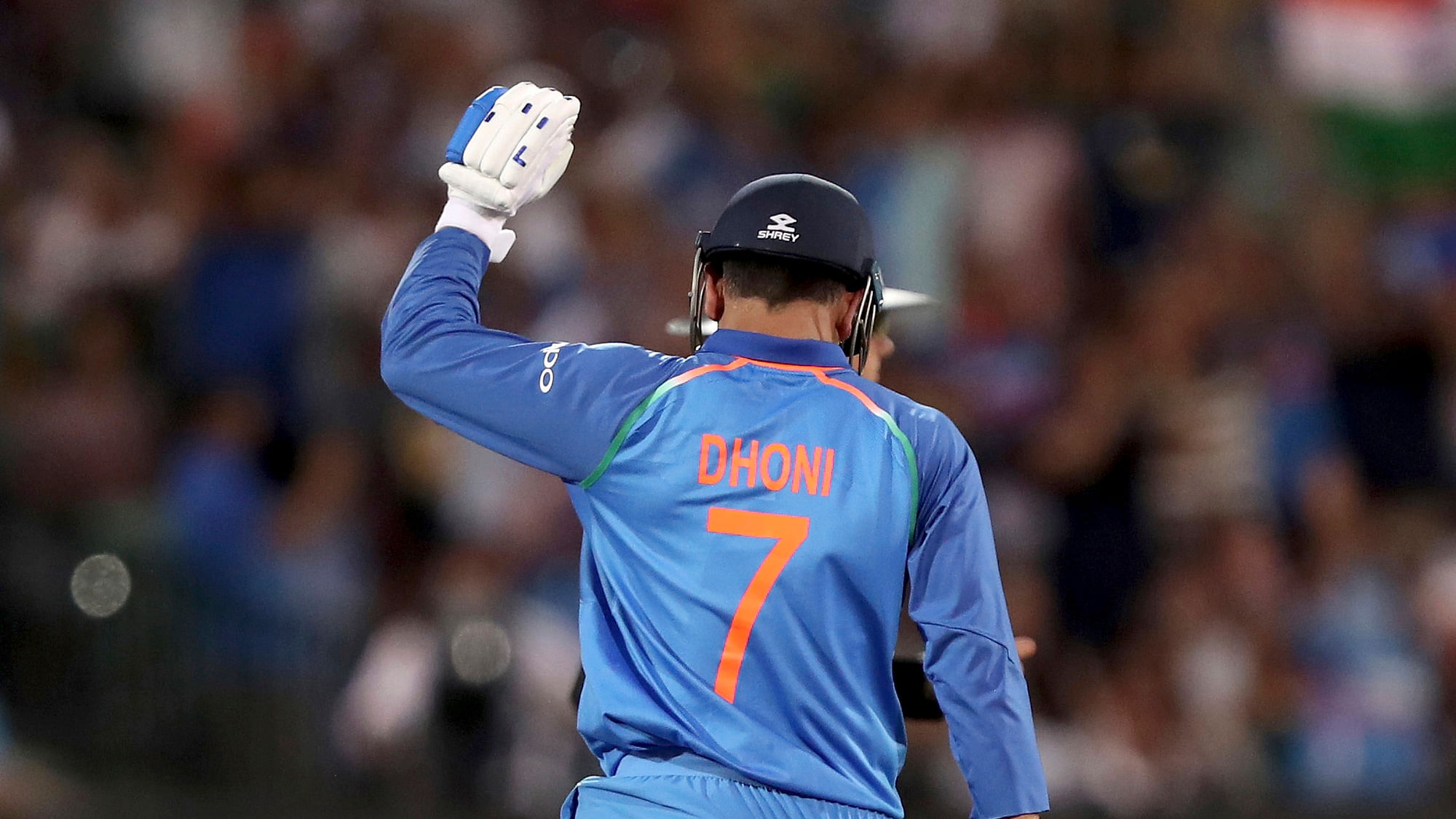 MS Dhoni celebrates after helping India win the third ODI against Australia in Melbourne.