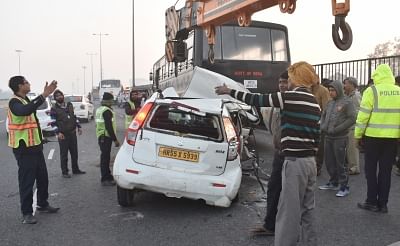 Gurugram: The taxi that rammed into a stationary National Security Guard (NSG) bus on the Delhi-Gurugram Expressway being removed, in Gurugram on Jan 27, 2019. Two people travelling in the taxi were killed in the accident. (Photo: IANS)