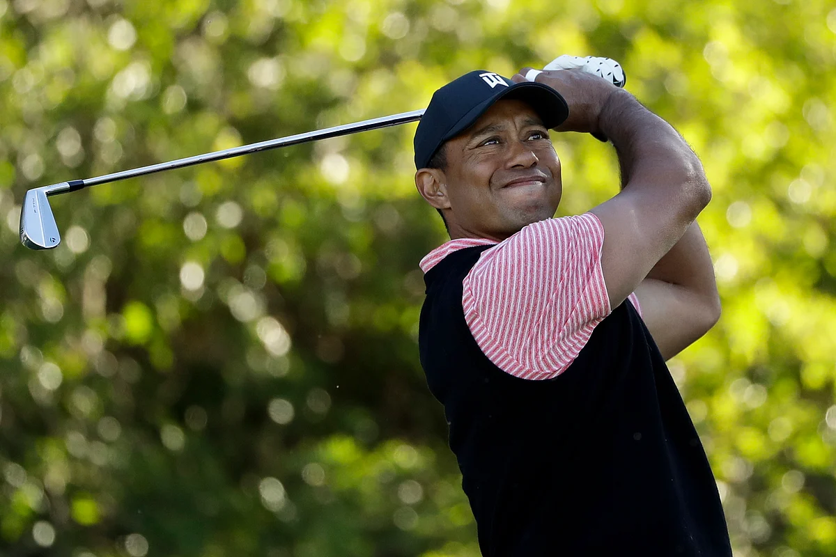 Tiger Woods hits his tee shot on the 11th hole of the South Course at Torrey Pines Golf Course during the final round of the Farmers Insurance golf tournament Sunday, Jan. 27, 2019, in San Diego.