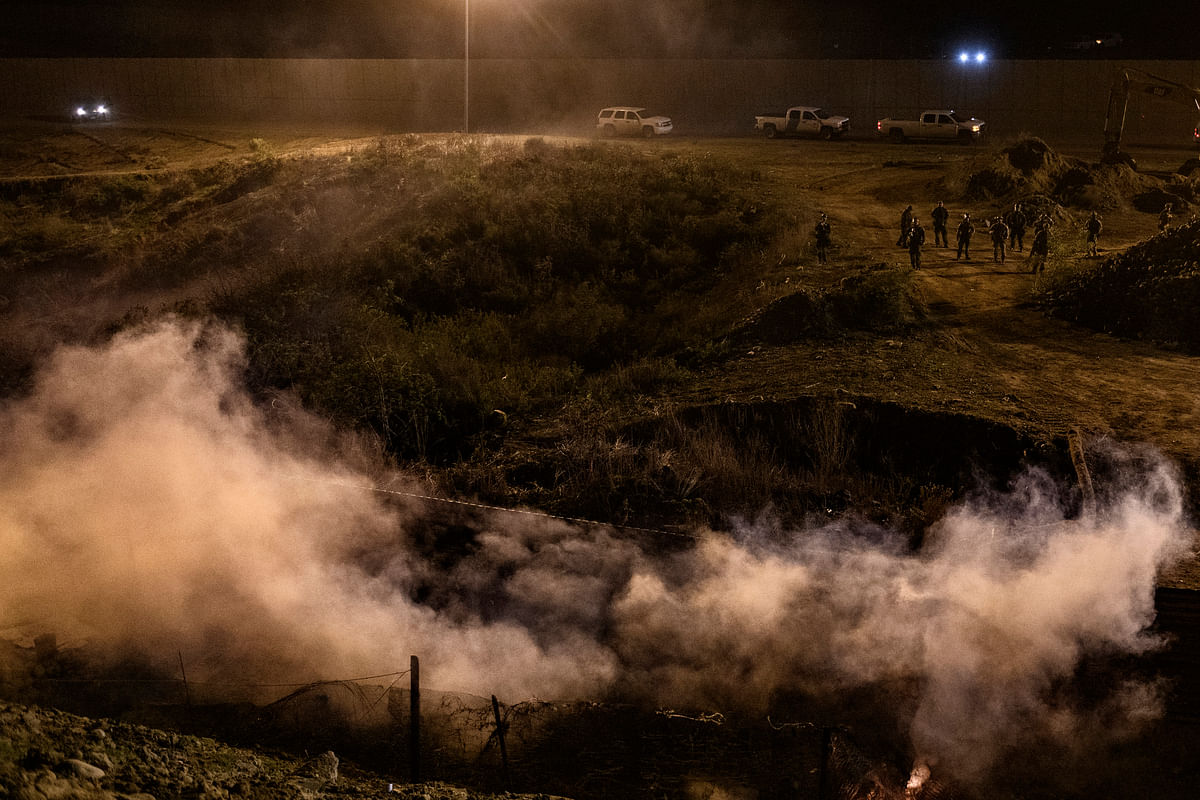 US authorities fired tear gas into Mexico during the first hours of the new year to repel about 150 migrants.