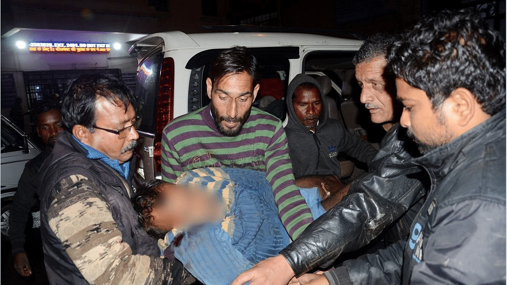An injured person being rushed to the hospital after a cable car collapsed at an under-construction ropeway project at Mahamaya temple in Jammu on Sunday, 20 January.&nbsp;
