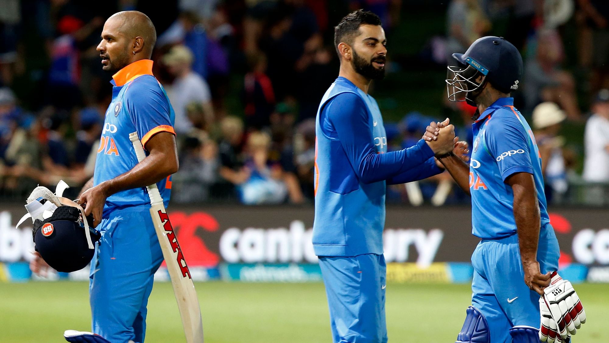 India walk off the field celebrating an 8-wicket win in the opening ODI of their five-match series in New Zealand at Napier.