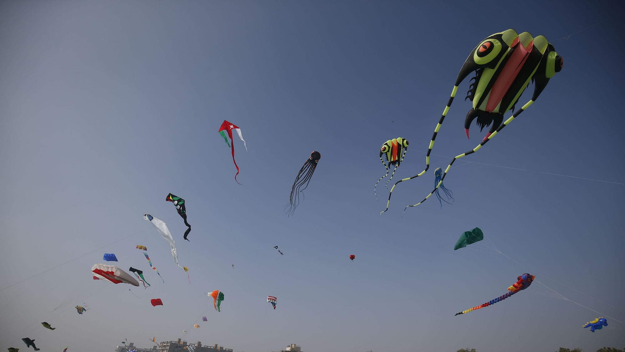 Colourful kites can be seen in the sky at the Sabarmati Riverfront in Ahmedabad