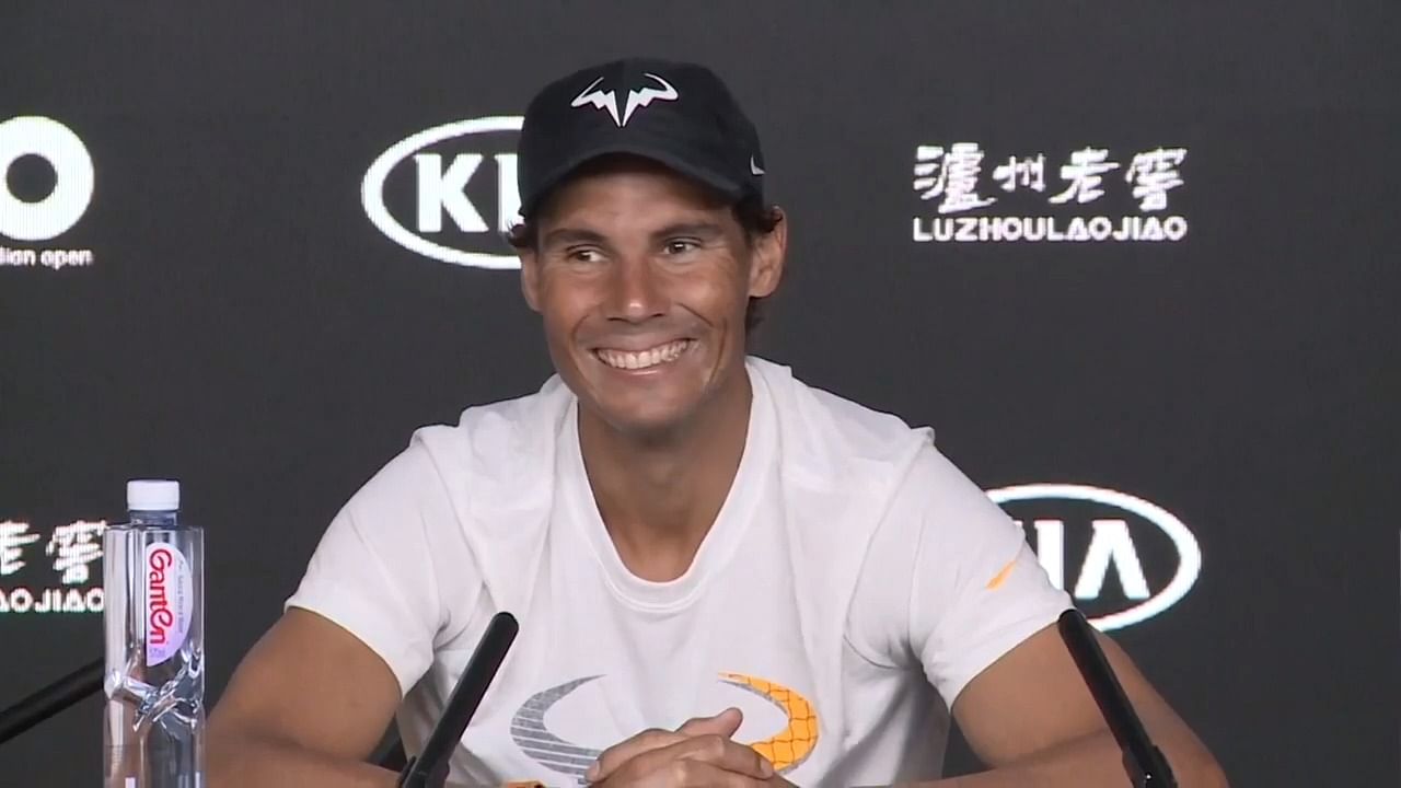 Nadal spotted the sleeping man while another journalist was asking him a question.