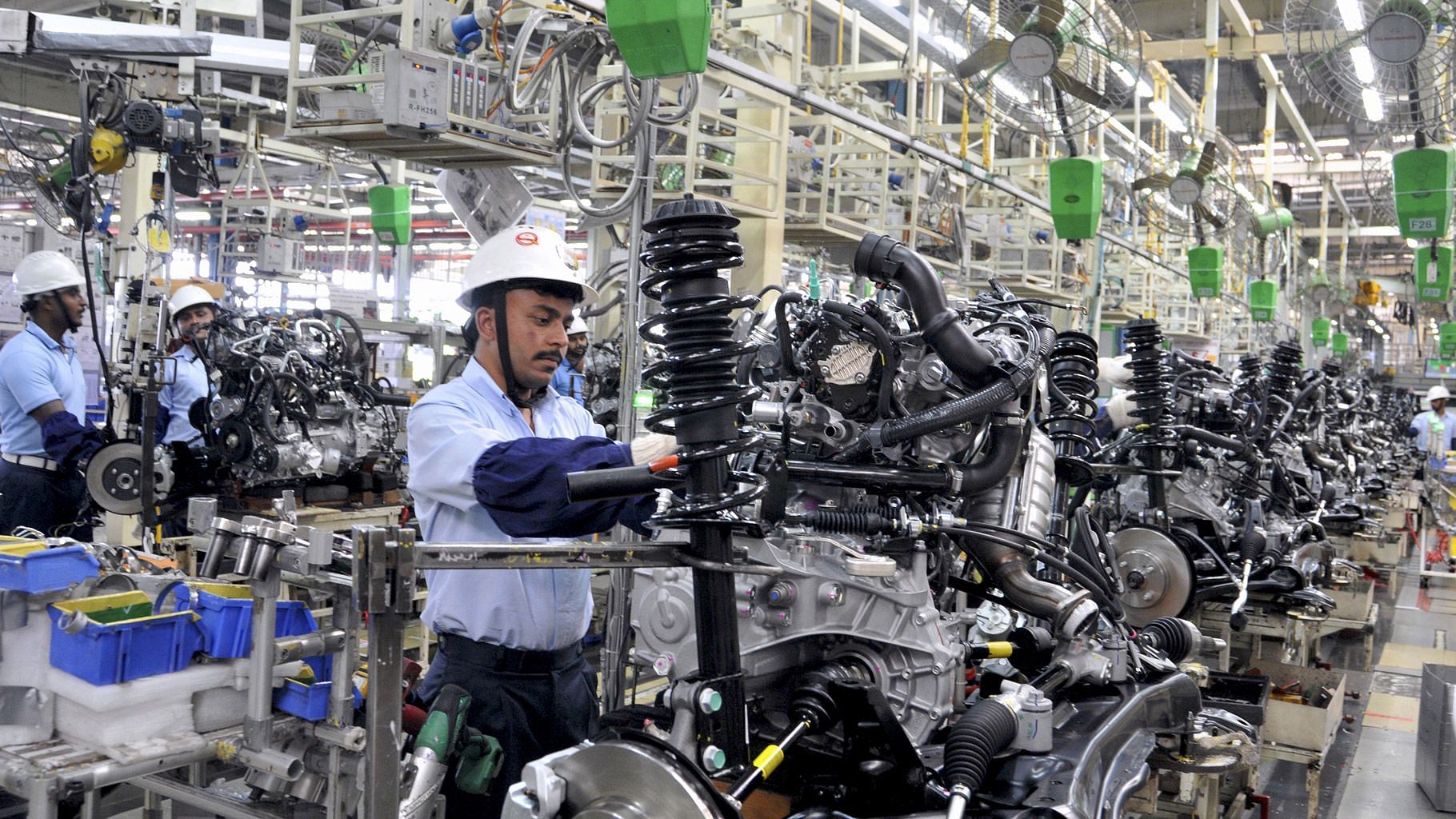 An employee works on Toyota car engines inside the manufacturing plant of Toyota Kirloskar Motor in Bidadi, on the outskirts of Bengaluru, 2015. (Photo: Reuters)