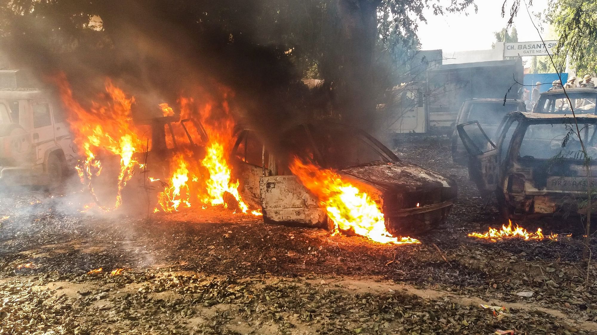 Vehicles set on fire by a mob during a protest over the alleged illegal slaughter of cattle in Bulandshahr.