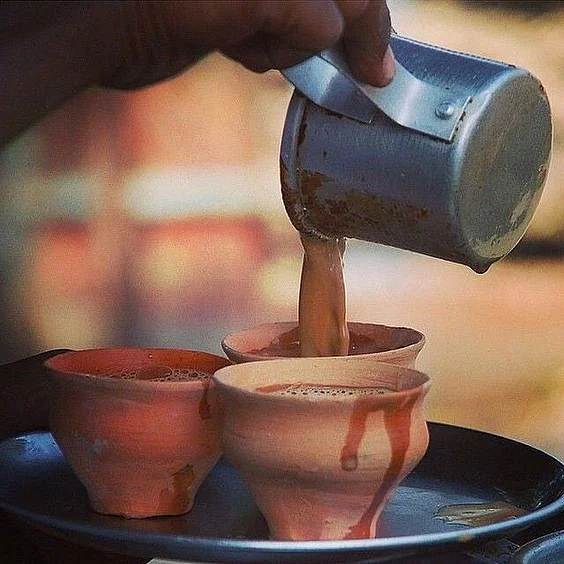 Pouring tea into a kulhad 