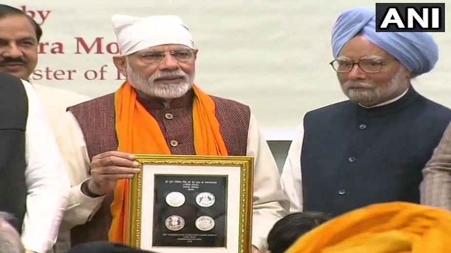 PM Modi and Dr Manmohan Singh at the event.
