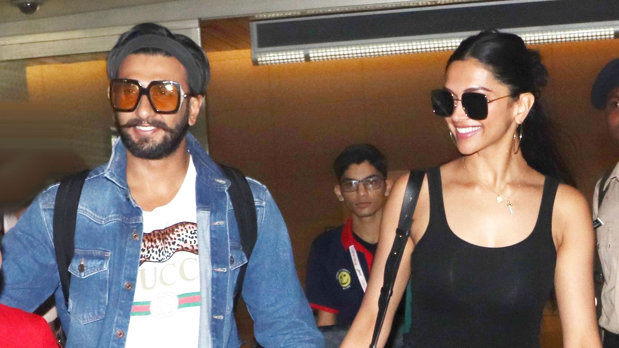 Ranveer Singh and Deepika Padukone arrive at the airport.