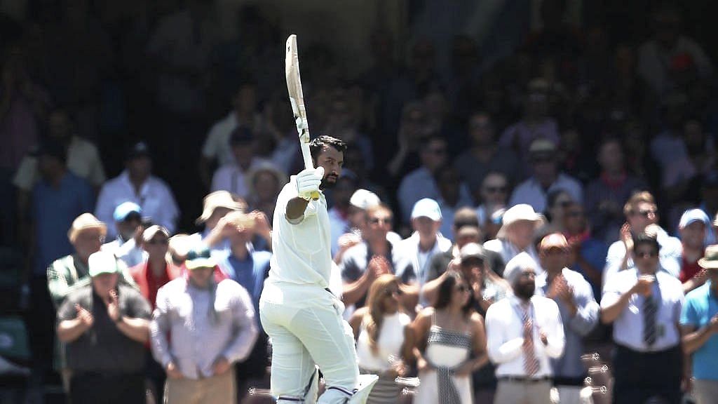 Cheteshwar Pujara receives a standing ovation from the Sydney crowd after his 193 in the fourth Test between India and Australia.