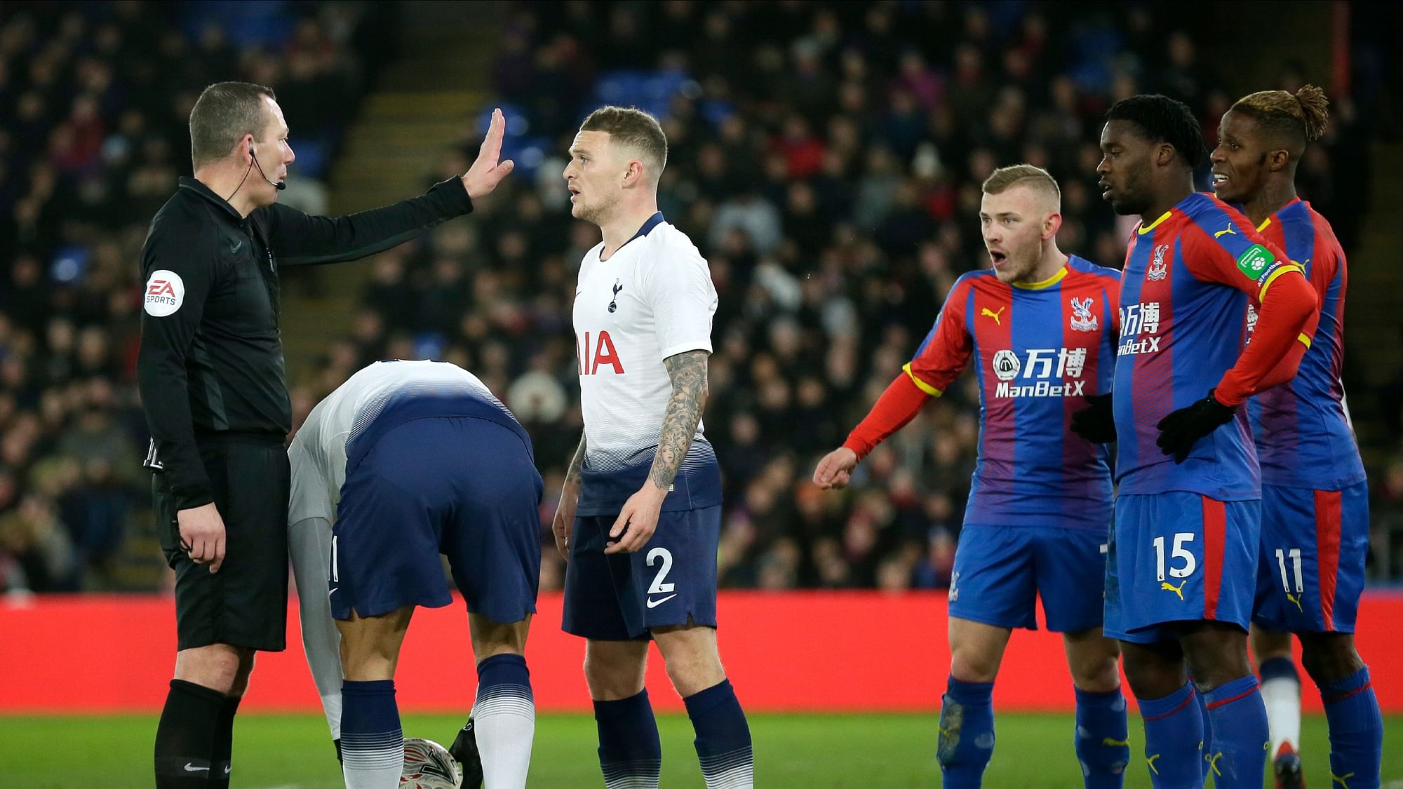 Referee Kevin Friend gestures to Tottenham’s Kieran Trippier during an English FA Cup fourth round soccer match between Crystal Palace and Tottenham Hotspur.