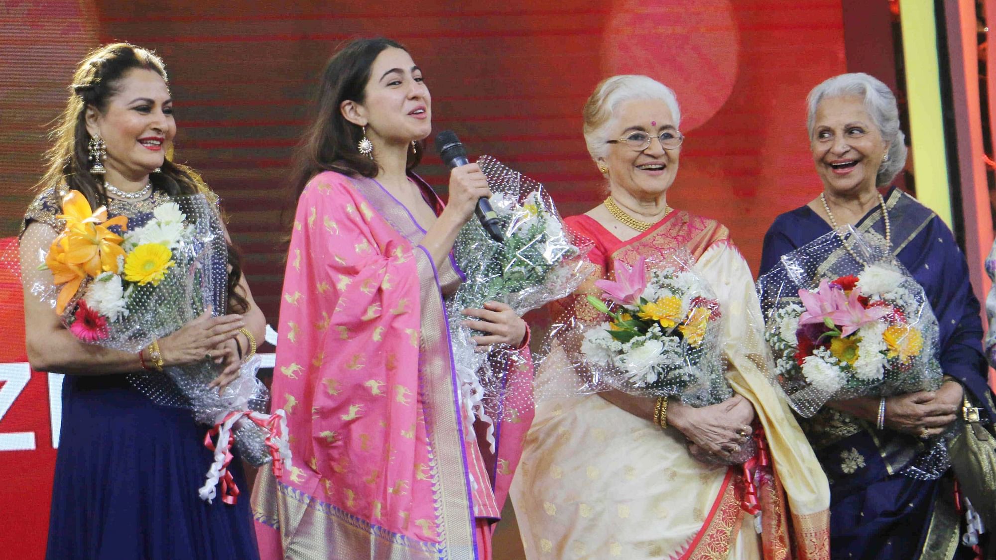 Sara Ali Khan addresses the audience as Jaya Prada, Asha Parekh and Waheeda Rehman look on.&nbsp;