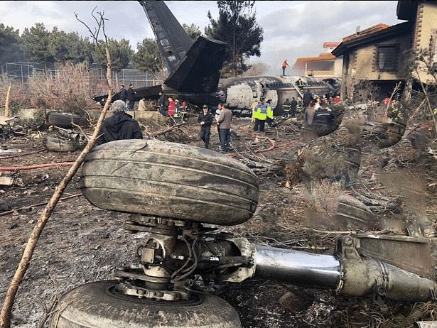Images carried by  media showed the burned-out tail of the plane sticking out, surrounded by charred homes.
