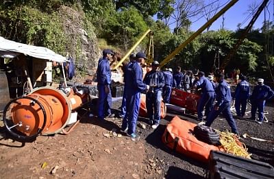 Ksan: Navy personnel involved in rescue operations at the site where 15 miners are trapped inside an illegal coal mine filled with water for two weeks now, in Ksan of Meghalaya