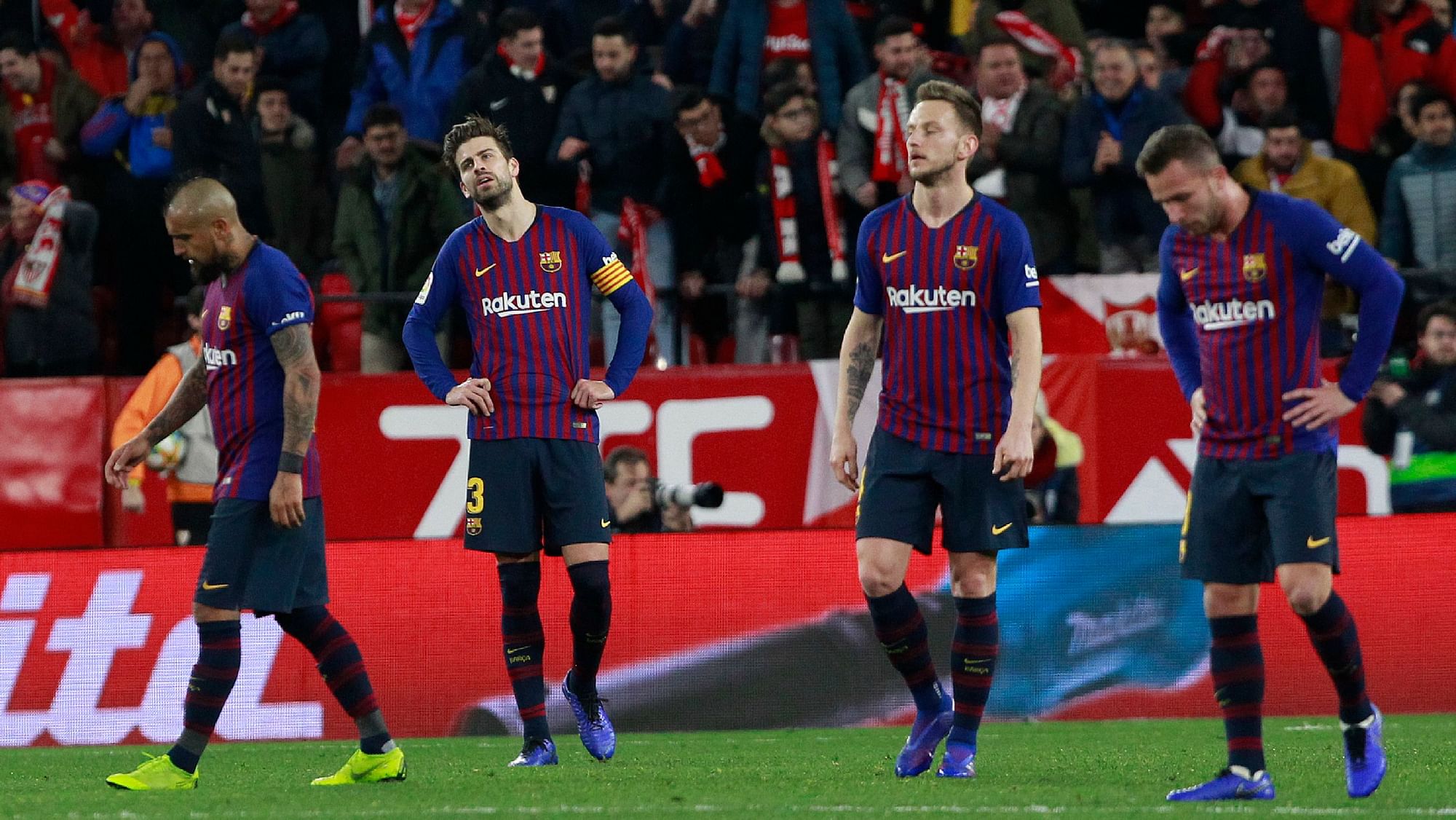Barcelona players cut a dejected figure during their 2-0 loss to Sevilla in the first leg of the Copa del Rey quarter-finals.