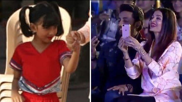 Aaradhya during her performance, while proud parents Abhishek and Aishwarya cheer for her.&nbsp;