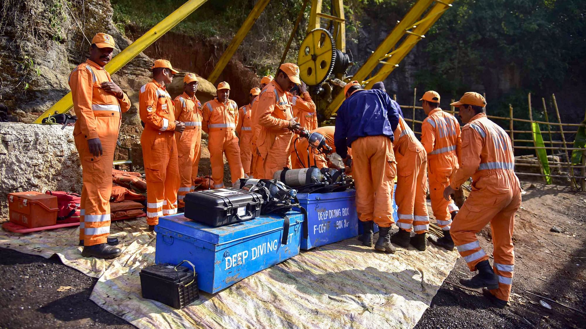 NDRF personnel conduct a rescue task at the site of a coal mine collapse.