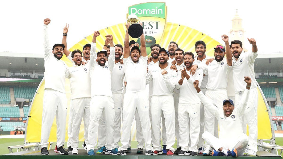 The Indian team lifts aloft the Border-Gavaskar Trophy, after claiming their maiden Test series win in Australia.