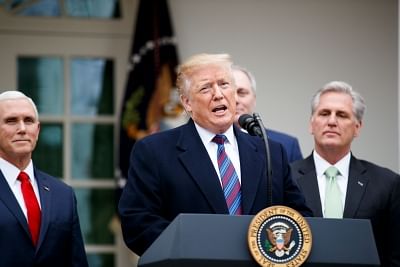 WASHINGTON, Jan. 4, 2019 (Xinhua) -- U.S. President Donald Trump (C) speaks during a press conference at the White House Rose Garden in Washington D.C., the United States, on Jan. 4, 2019. Trump said Friday that he