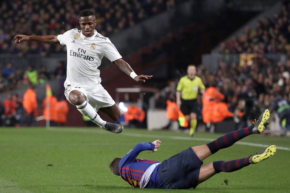 Real Madrid earned a 1-1 draw at Barcelona to take a slim away-goal advantage after the Copa del Rey semifinal.