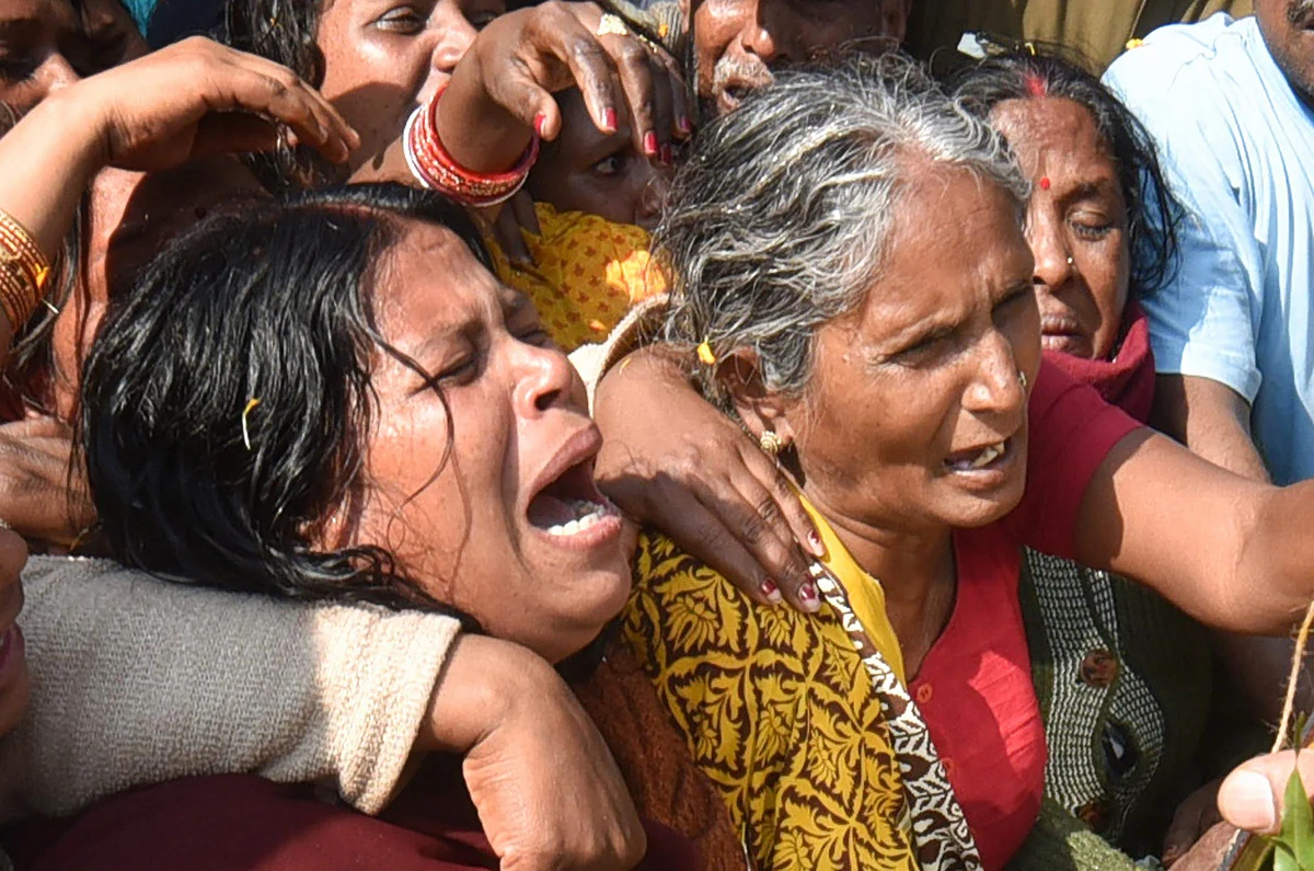 Family members of slain CRPF Sanjay Kumar Singh cry during the funeral procession, at Masaurhi, in Patna. 