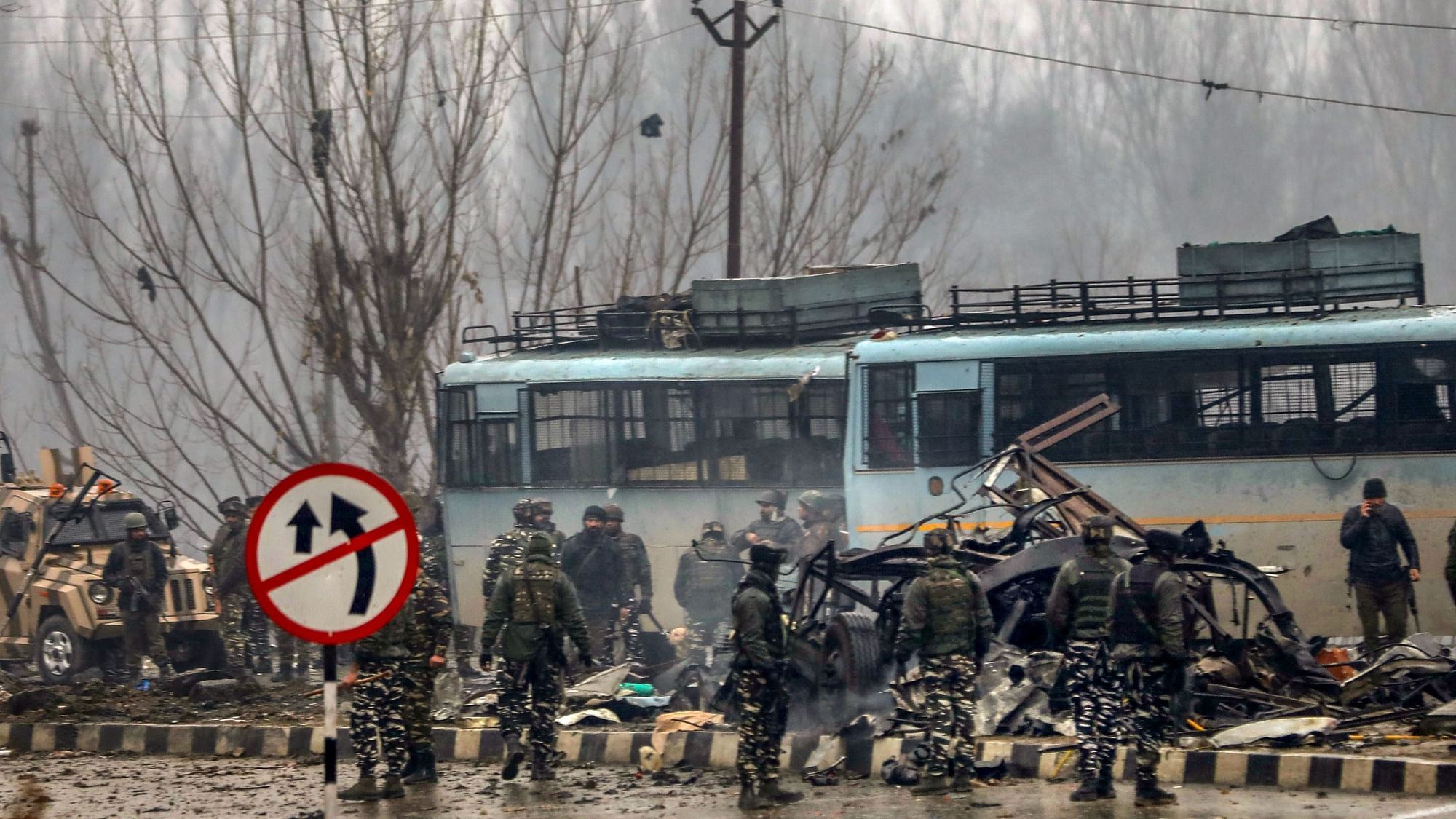 Security personnel carry out rescue and relief operations at the site of a suicide bomb attack in Pulwama district of south Kashmir.