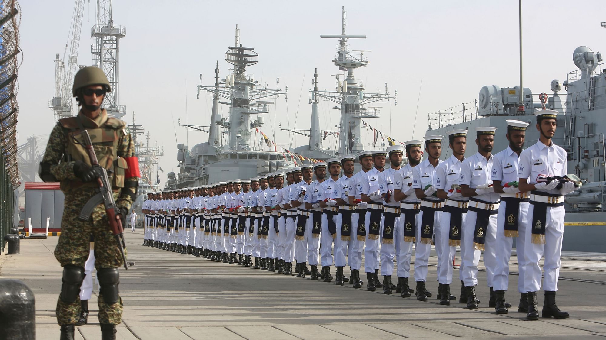 Pakistan Naval personal carry national flags of participating countries during the opening ceremony of Pakistan Navy’s Multinational Exercise AMAN-19, in Karachi, Pakistan.