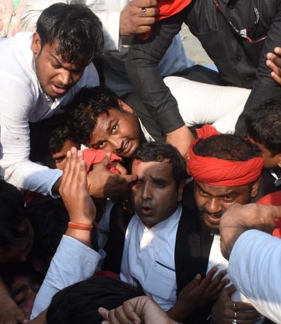 MP Dharmendra Yadav was among those injured as SP workers protested Yogi-govt stopped Akhilesh Yadav at airport.