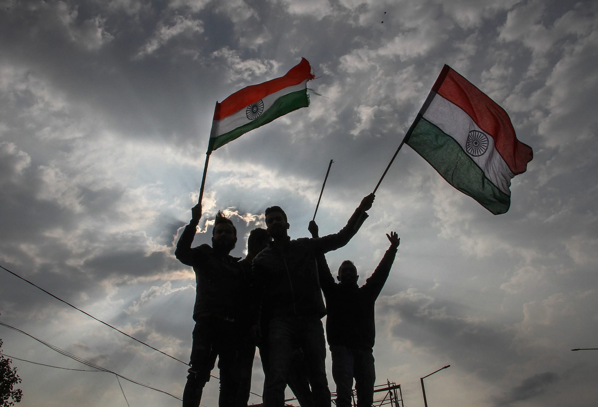 Protesters holding tricolour raise slogans during a demonstration against the Pulwama terror attack in Jammu, Friday, 15 February. At least 40 CRPF personnel were killed and five injured on 14 February in one of the deadliest terror attacks in Jammu and Kashmir when a Jaish-e-Mohammed suicide bomber rammed a vehicle carrying over 350 kg of explosives into their bus in Pulwama district.&nbsp;