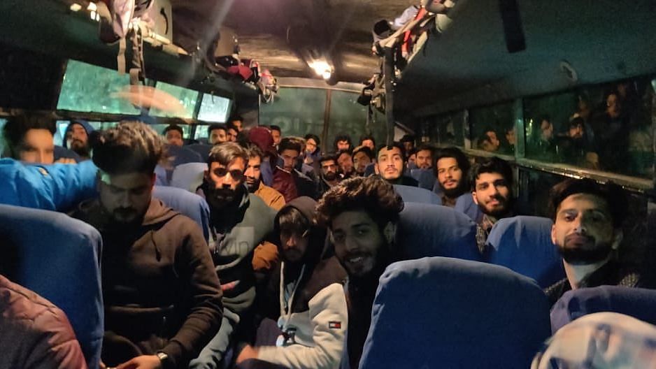 Stranded Kashmiris heading back home in a bus arranged by Khalsa Aid.