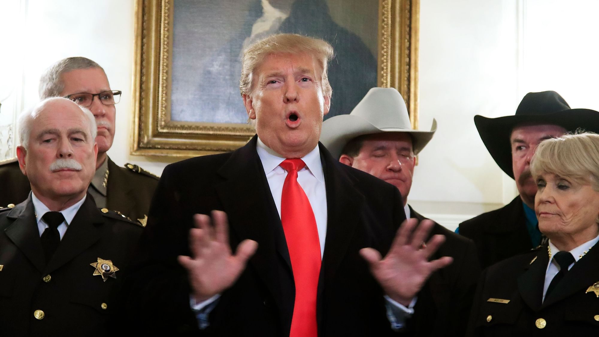President Donald Trump speaks during a meeting with a group of sheriffs before leaving the White House in Washington, Monday, 11 February, for a trip to El Paso, Texas.