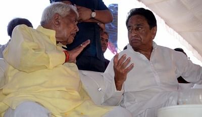 Bhopal: BJP leader Babulal Gaur in a conversation with Madhya Pradesh Congress chief Kamal Nath during a programme, in Bhopal on June 10, 2018. (Photo: IANS)