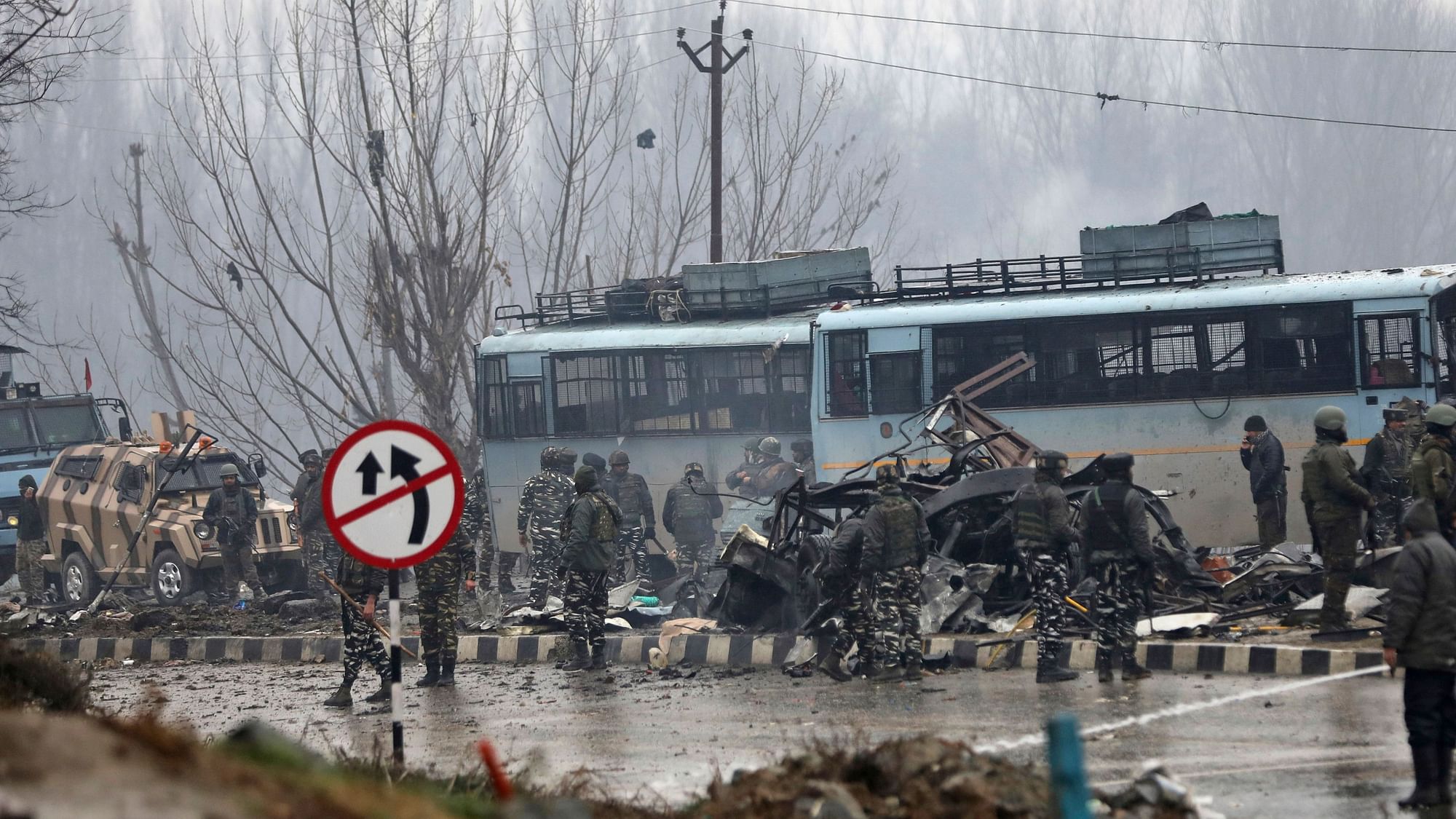 Security personnel carry out the rescue and relief works at the site of suicide bomb attack at Lathepora Awantipora in Pulwama district of south Kashmir, Thursday, 14 February.&nbsp;
