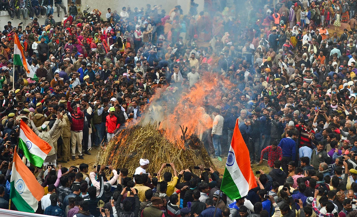 People gather during the cremation ceremony of slain CRPF jawan Kaushal Kumar Rawat , in Agra on 16 February 2019. 
