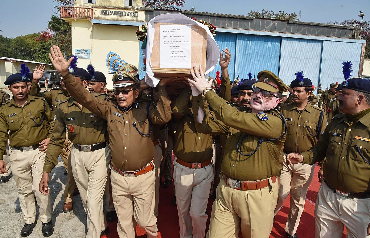 DGP Gupteshwar Pandey and police personnel carry the coffin of slain CRPF jawan Ratan Thakur for last rites, in Patna.