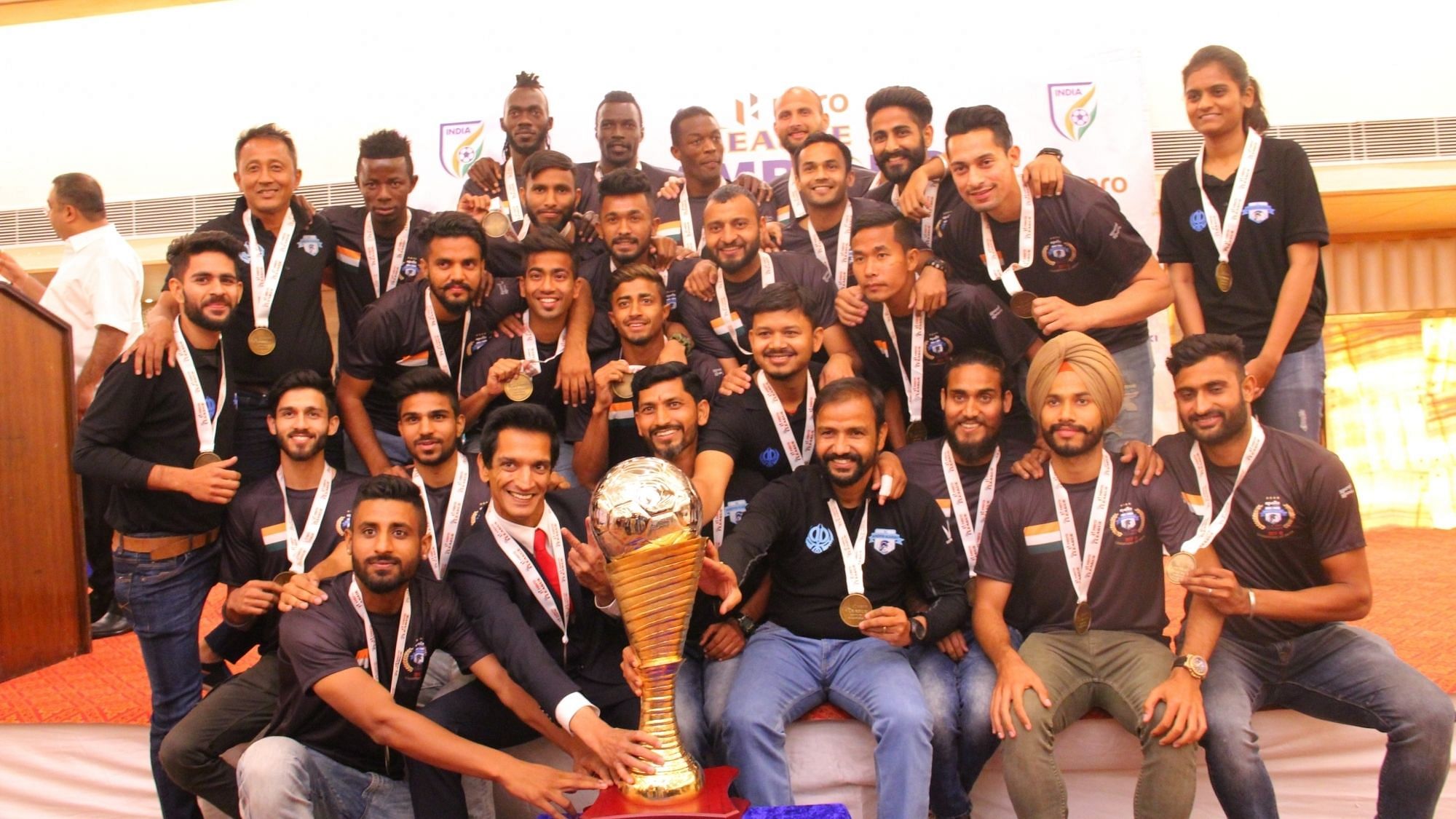 File photo of Minerva Punjab FC players with their I-League Trophy during a presentation ceremony in Chandigarh on 22 March 2018.&nbsp;